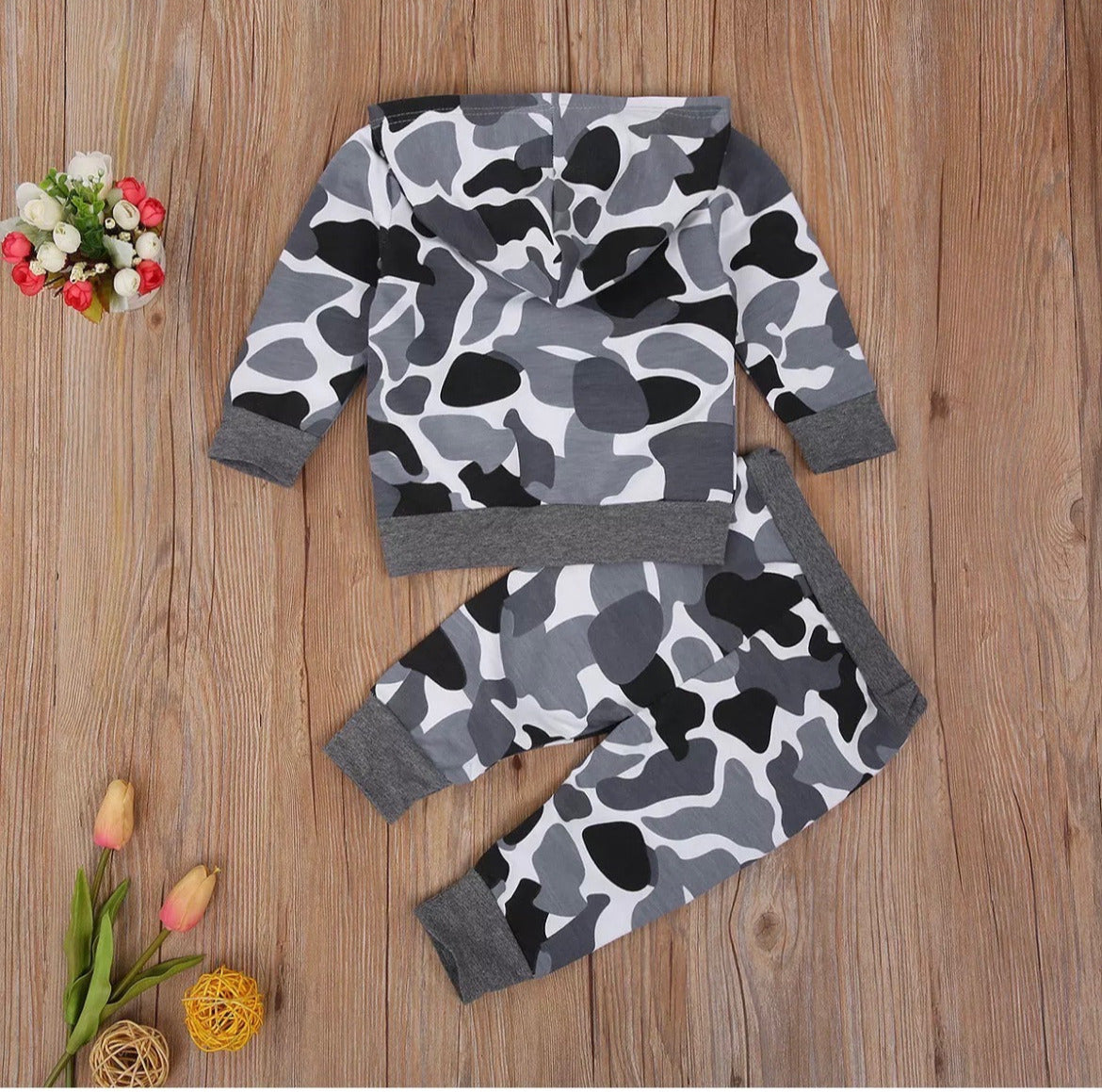 Boys camo hoodie and jogger suit with stylish black,grey, and white camouflage print, featuring a front kangaroo pocket. perfect for active kids who love adventure and outdoor play, this trendy outfit offers durability and flexibility for everyday wear.