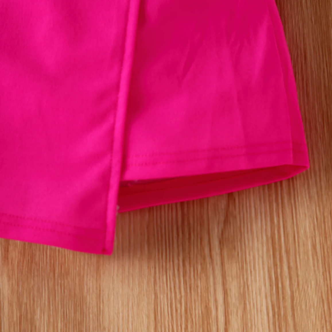 Solid color girls' skirt with cute bow tie details and an elastic waistband perfect for everyday wear.