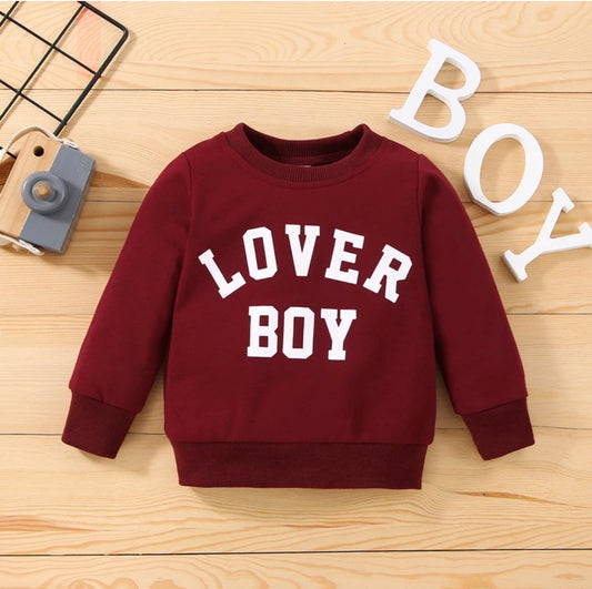 “Front view of the Kids’ Boy Crew Neck Sweater featuring ‘Lover Boy’ in bold letters across the chest. Made from soft, high-quality fabric, this stylish sweater offers warmth and comfort for boys, perfect for casual outings or playdates.”