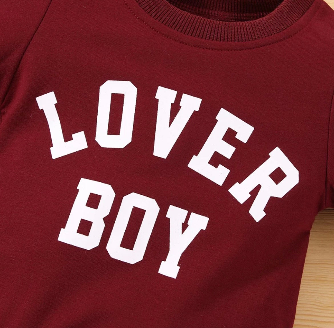 “Front view of the Kids’ Boy Crew Neck Sweater featuring ‘Lover Boy’ in bold letters across the chest. Made from soft, high-quality fabric, this stylish sweater offers warmth and comfort for boys, perfect for casual outings or playdates.”