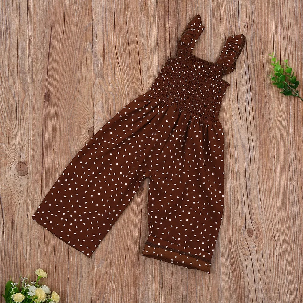 “Adorable girls’ polka-dotted wide-legged romper in a stylish tank top design, perfect for summer. Crafted from soft, breathable fabric, this romper features a fun polka dot print and flowy wide-legged bottoms for easy movement. Ideal for casual outings or playdates, this cute romper combines comfort and vibrant style for your little one. Available in multiple sizes for a perfect fit.”