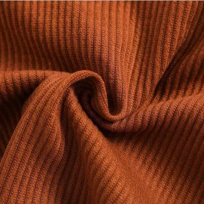 Close-up detail of the ribbed fabric used in the Girls’ Ribbed Mid-Cut Jogging Suit, emphasizing its trendy texture and durable quality for active kids.